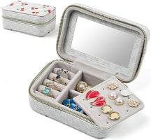 Gray jewelry box with mirror lid, compartments for rings and earrings, and cherry-patterned lid.