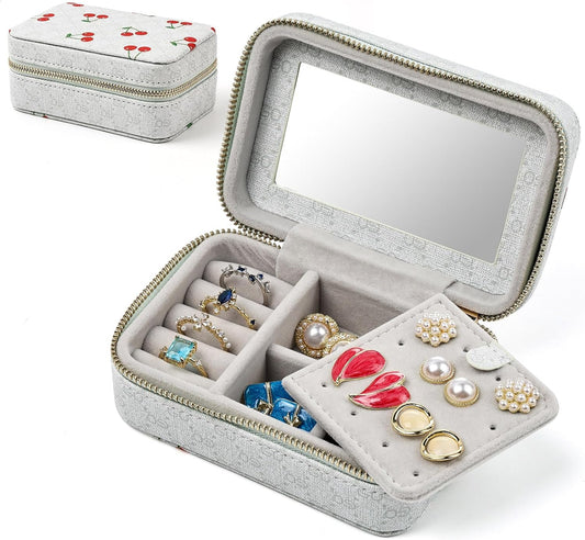 Gray jewelry box with mirror lid, compartments for rings and earrings, and cherry-patterned lid.