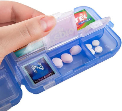 Blue pill organizer with white pills and visible brand labels held by a hand.